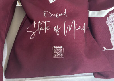 Burgundy bag for Oxford Scholars Programme that reads "Oxford State of Mind"