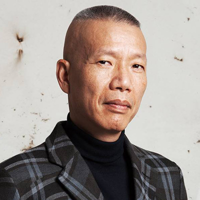 Headshot photo of Cai Guo-Qiang