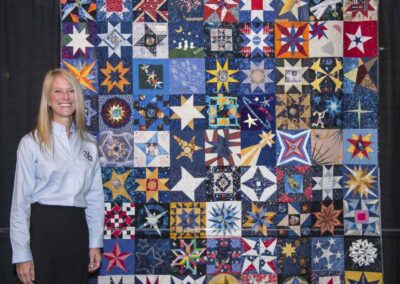 Astronaut Karen Nyberg presenting the NASA Astronomical Quilts! Block Challenge at the annual International Quilt Festival in Houston. Photographer Lauren Harnett