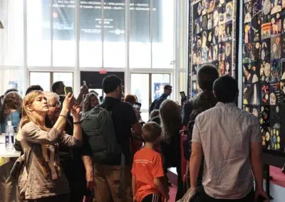 Crowd viewing the Lunar Quilts exhibit by astronaut Karen Nyberg during Earth to Space Festival
